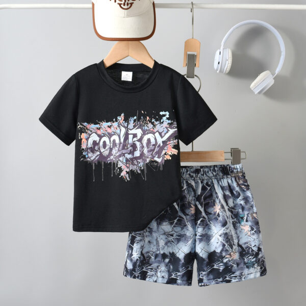 Boys&apos; urban street style outfit trend with colorful ink graffiti T-shirt + camouflage shorts set